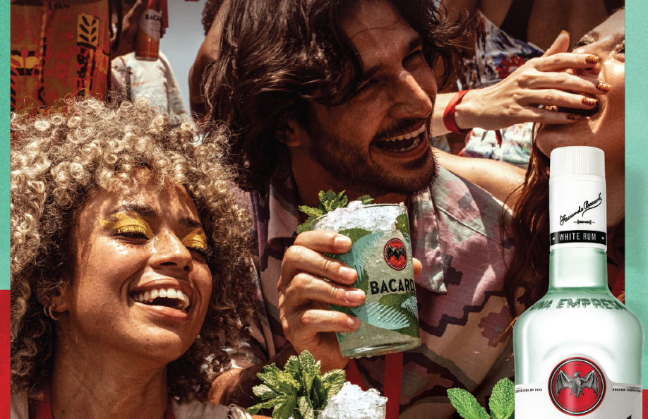 Friends dancing with BACARDÍ mojitos