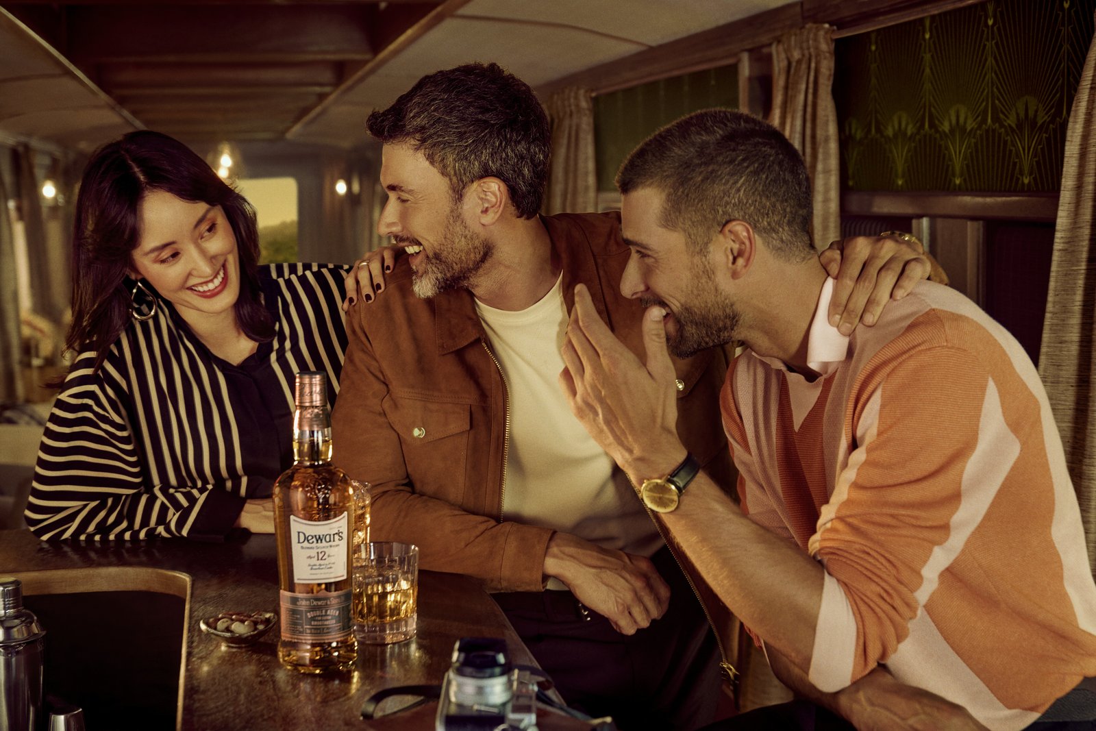 Friends over Dewar's on the Caledonian train