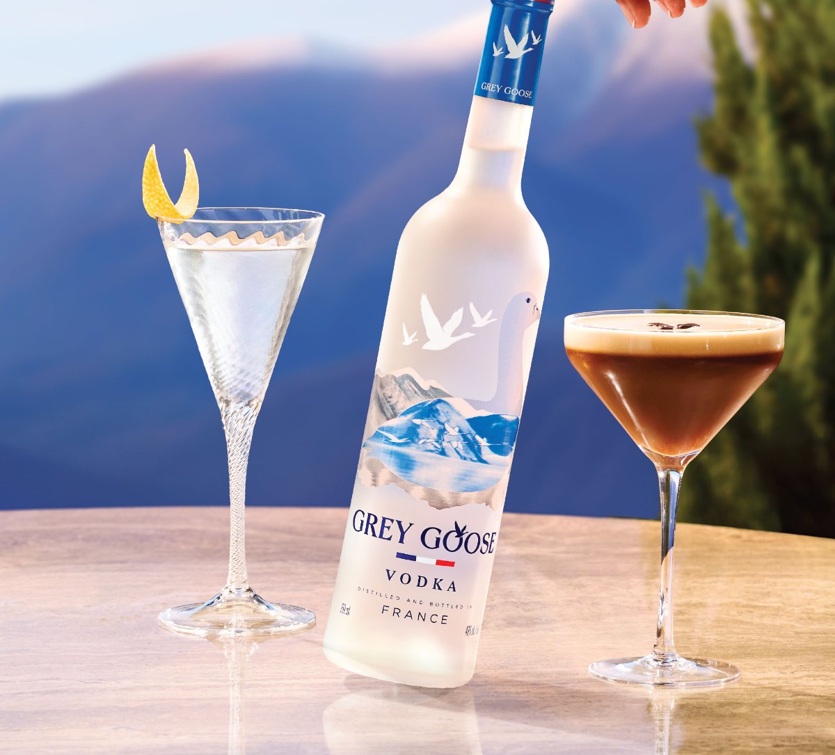 Grey Goose on a mountain terrace with two Martinis